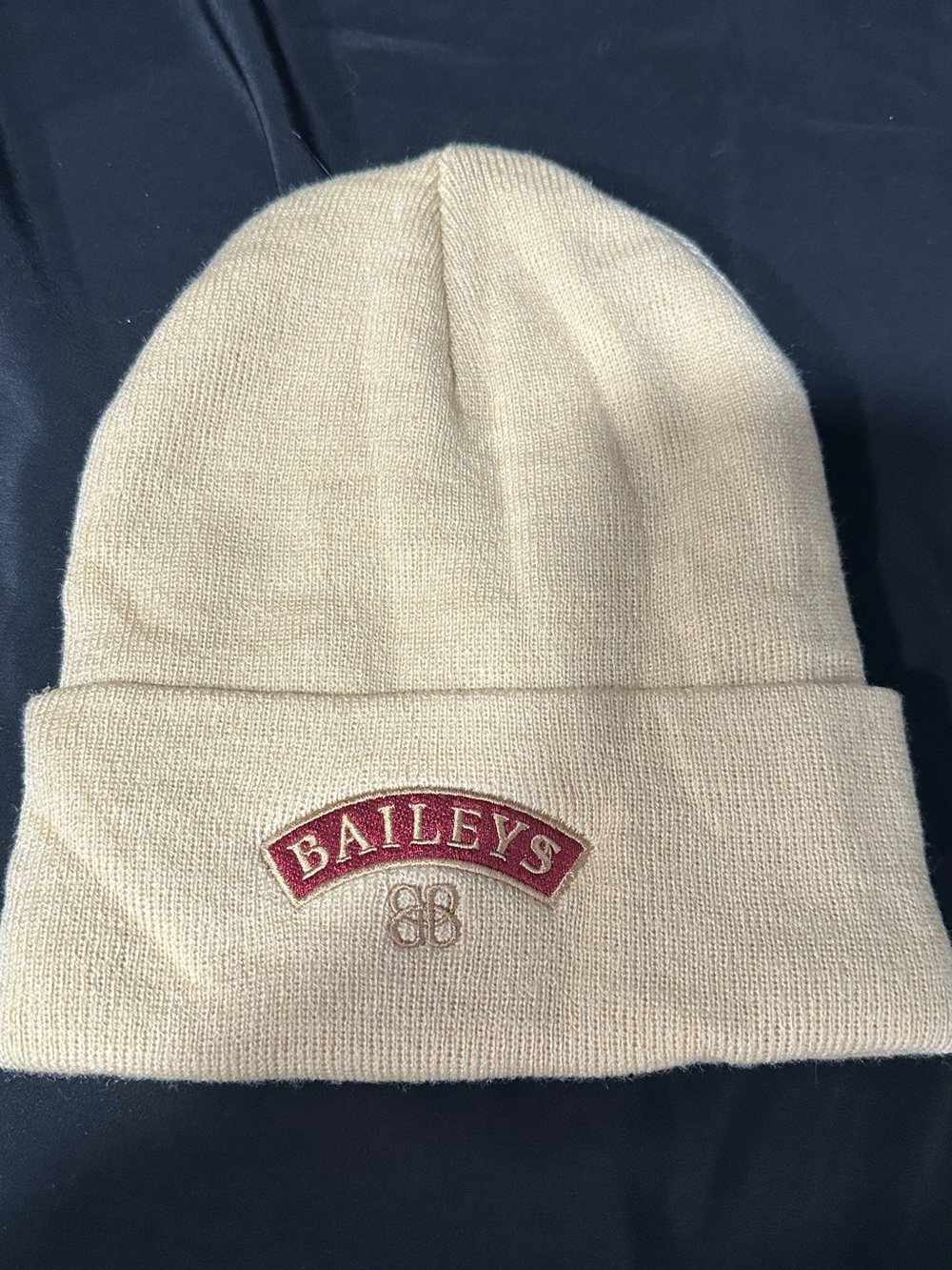 Bailey’s gold/cream colored beanie hat, brand new never worn.